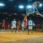a basketball player dunking a ball in a basketball court